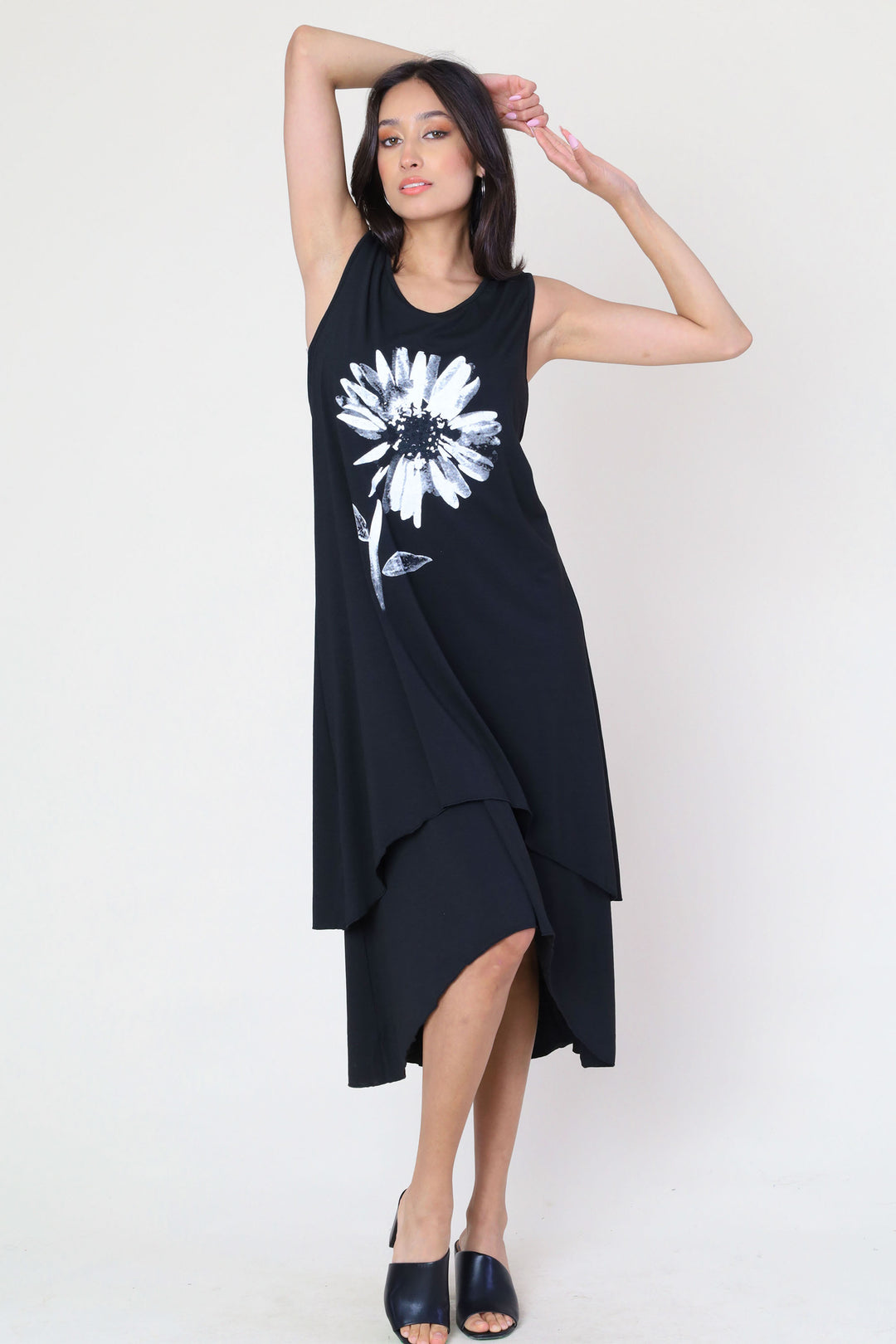 Fun Sport Summer 2024  Its loose high-low cut layered hem adds a touch of modernity to the classic silhouette, while the daisy on the chest adds a playful element. 