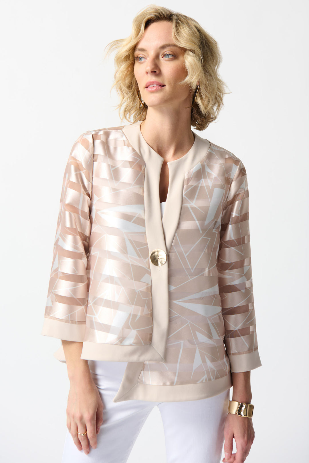 JOSEPH RIBKOFF Spring 2024 The boxy fit and gold button create a sleek and daring look, while the uneven front hem cut adds a touch of uniqueness.