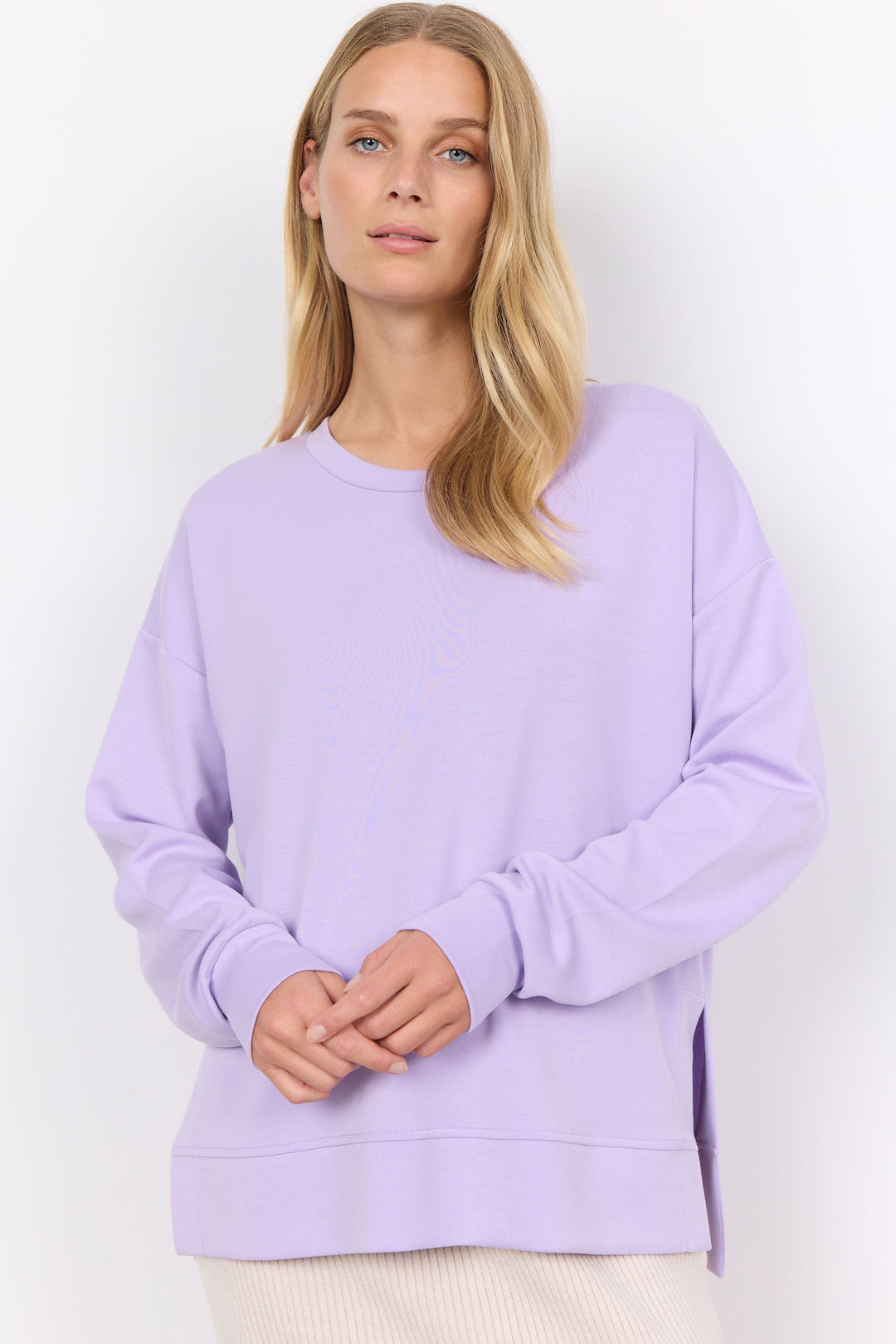 This Long Sleeve Sweater Top offers a simple and classy look with a looser fit and round neck. 