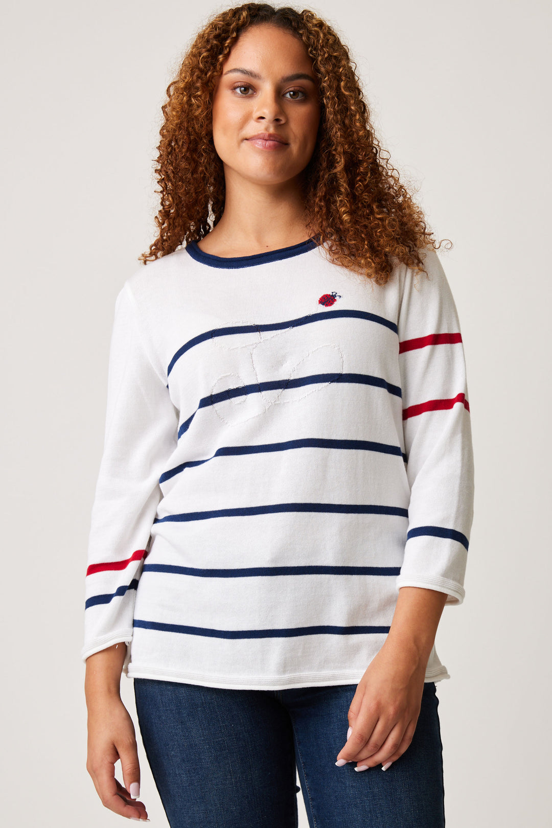 Cotton Country Spring 2024 a knit cotton sweater top with a playful stripes design, 3/4 sleeves and a round neck. 