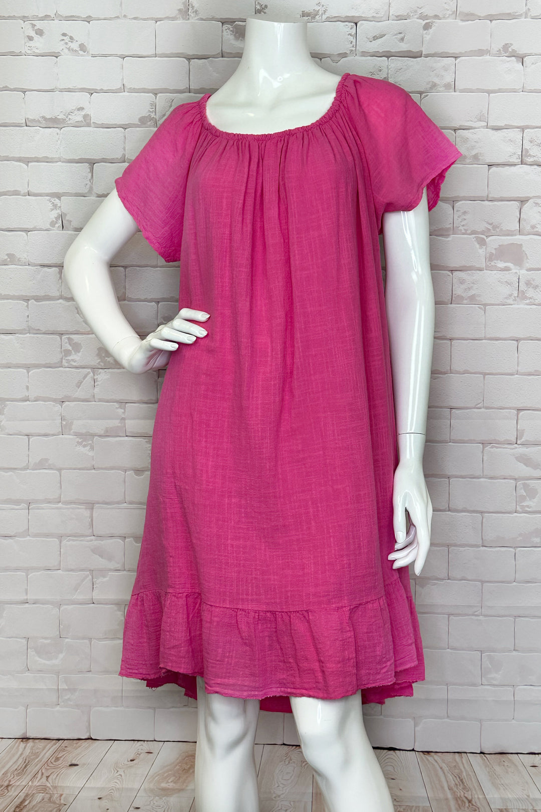 Cherishh Spring 2024 This simple cotton dress comes in solid colours and features a flowy fit. The wavy hem with ruffles adds a touch of elegance to this easygoing piece. 