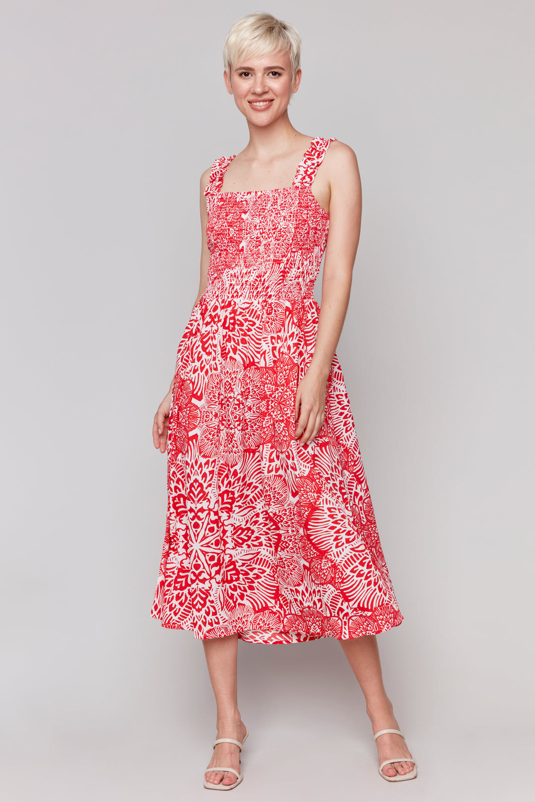 Charlie B Spring 2025  This midi length dress has a square cut collar on both the front and back for a unique look. With a free and flowy fit and a fancy floral print, it's the perfect addition to your wardrobe. 