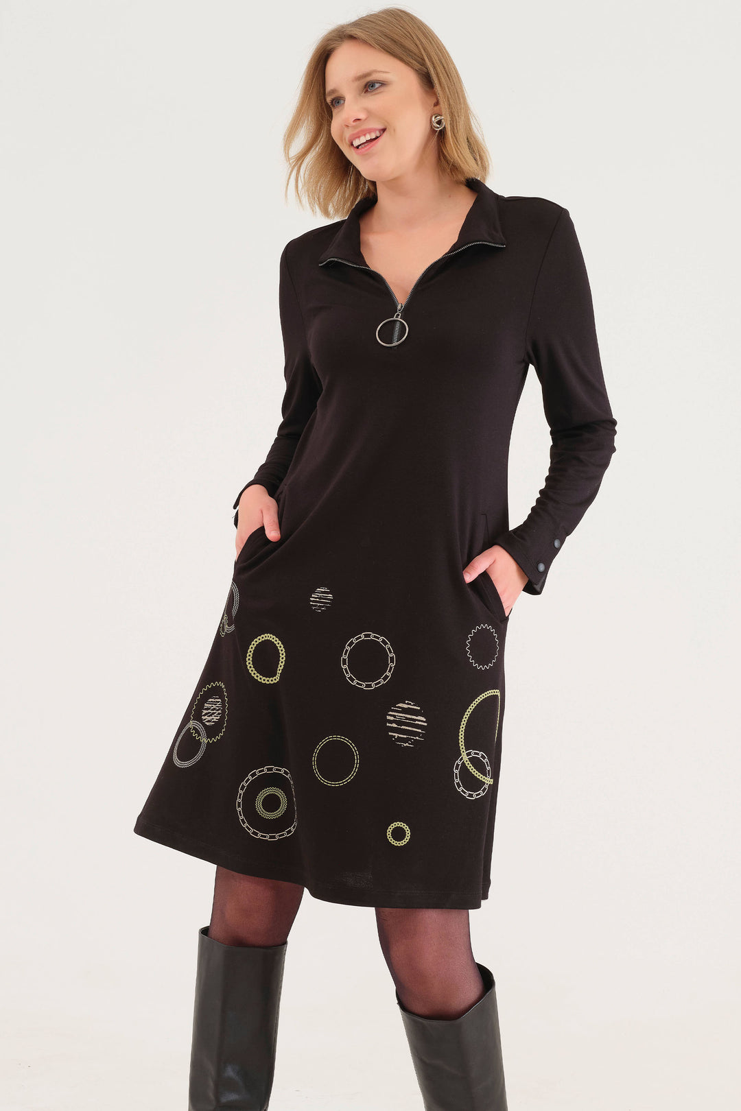 Dolcezza Fall 2025 
 Designed with a zippered mock neck and button cuffs, it offers subtle detailing that enhances its sleek silhouette. 