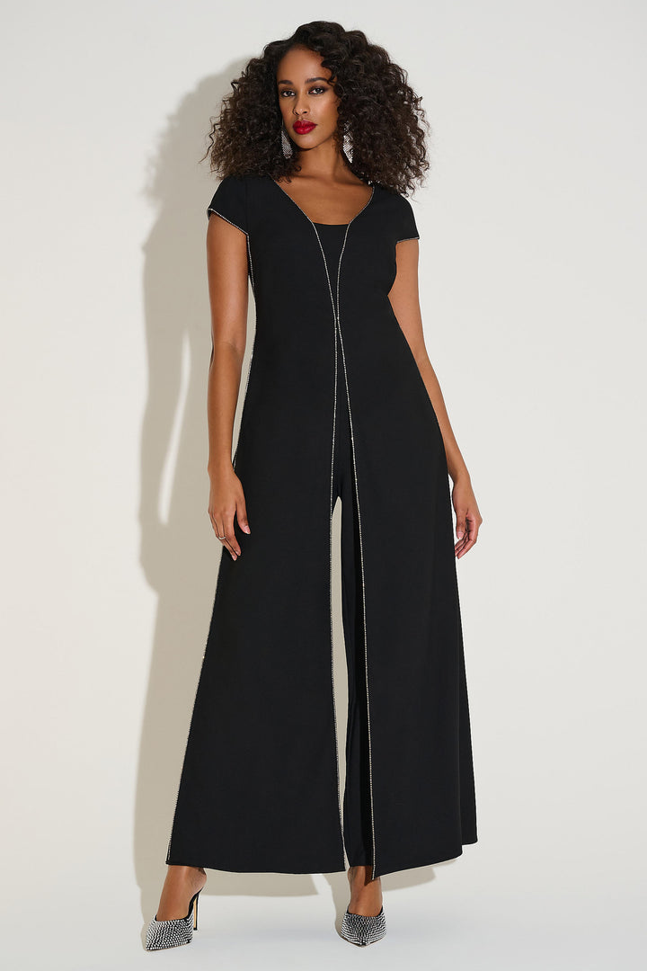 Woman wearing a black jumpsuit with a zipper on a white background