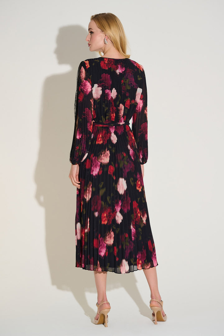 Woman wearing a floral dress with a plain background