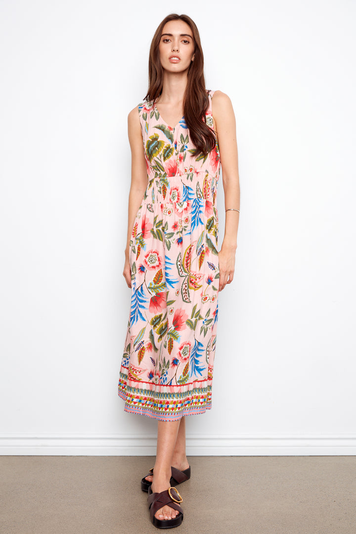 Woman wearing a floral dress against a white background