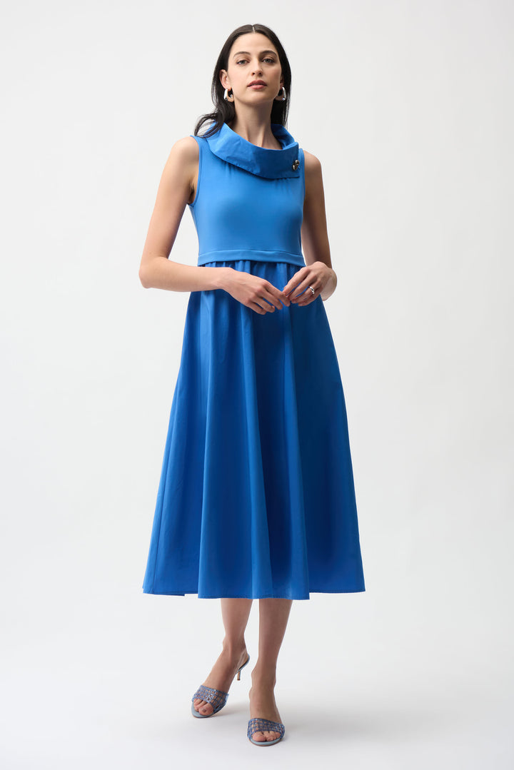 Woman wearing a blue dress on a white background