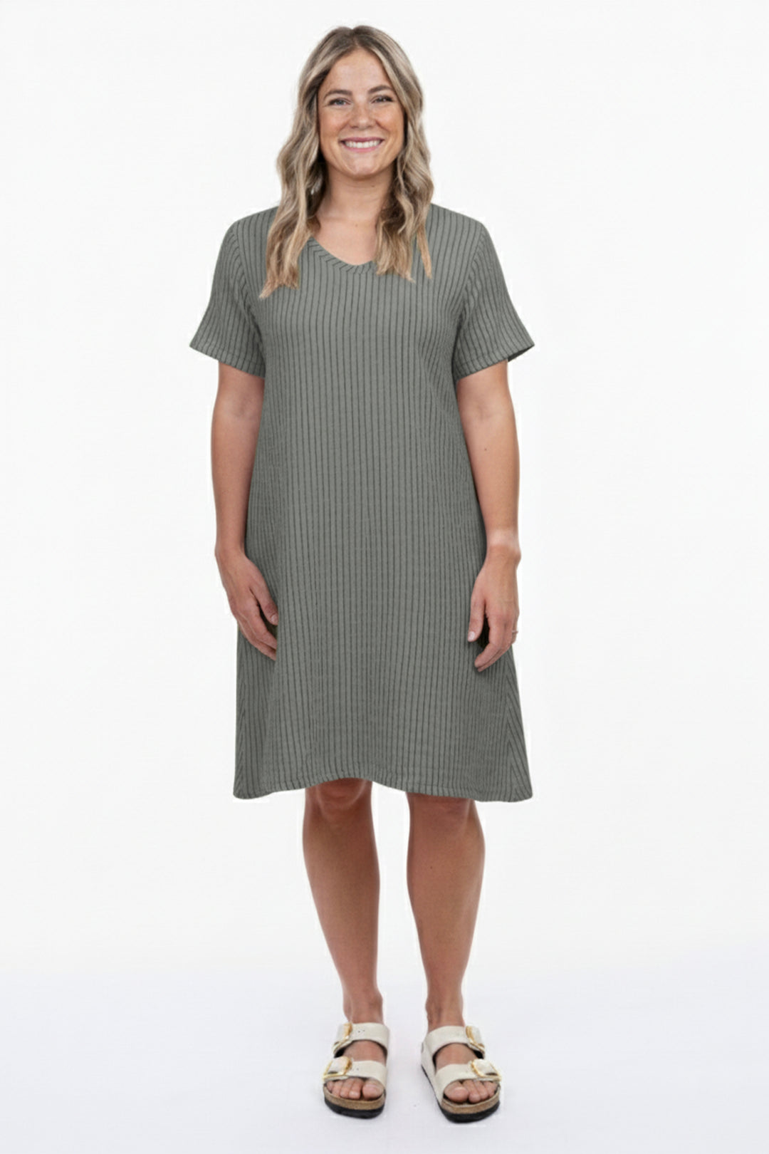 Woman wearing a gray dress on a white background