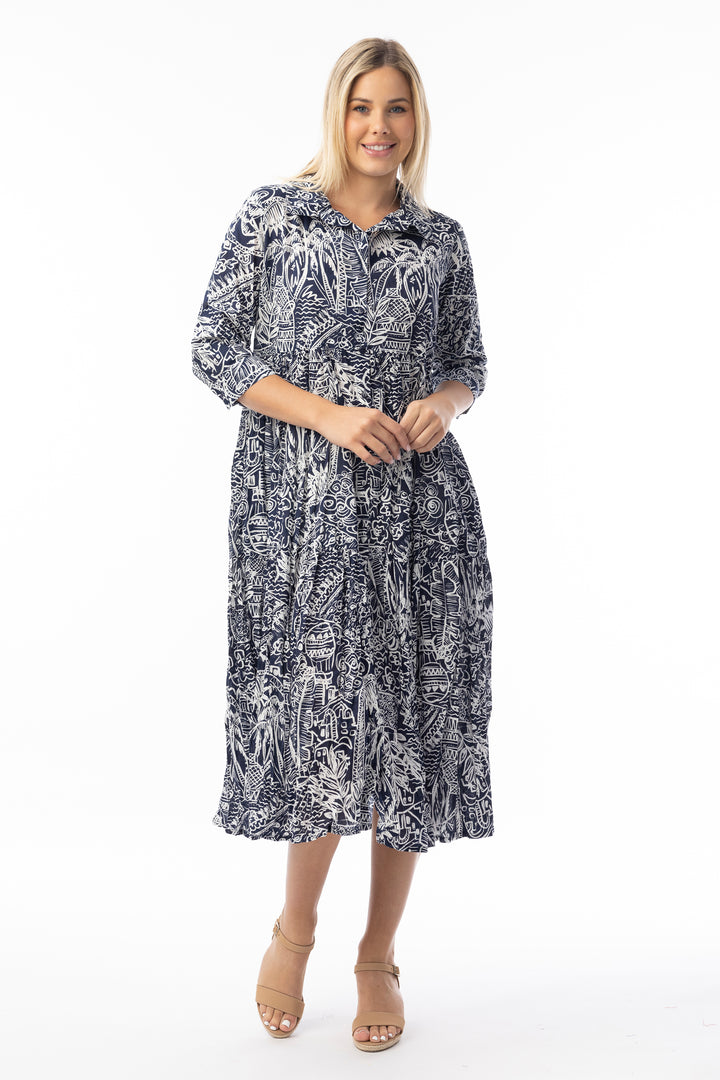 Woman wearing a black and white patterned dress on a white background