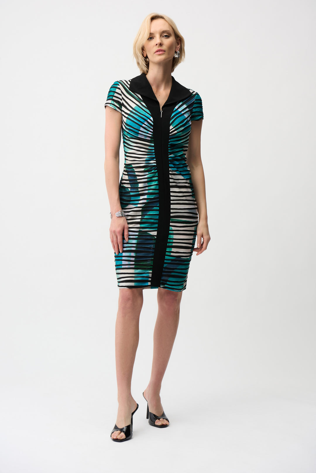 Woman wearing a patterned dress on a white background