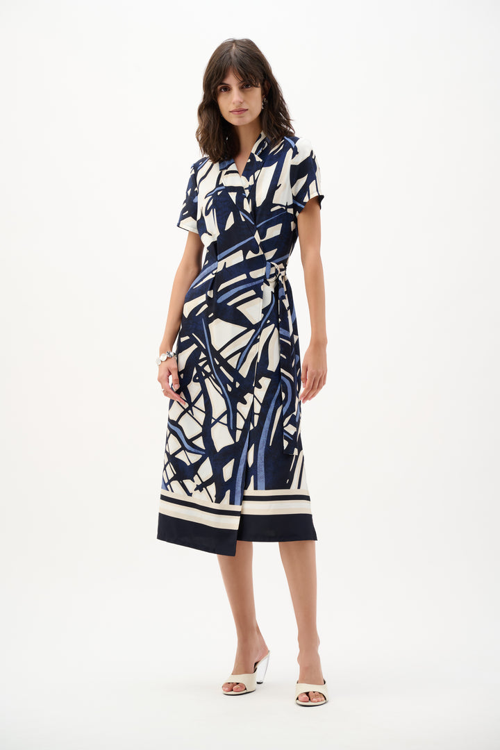 Woman wearing a patterned dress on a white background