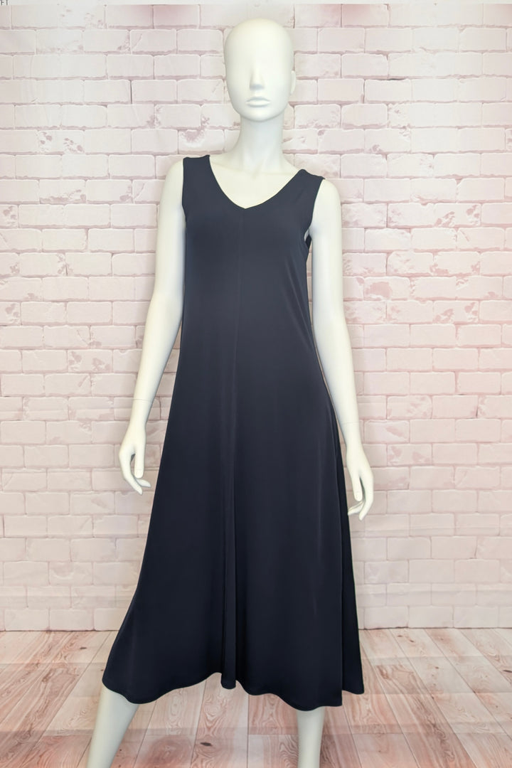 Dark navy blue sleeveless dress on a mannequin against a light brick wall.