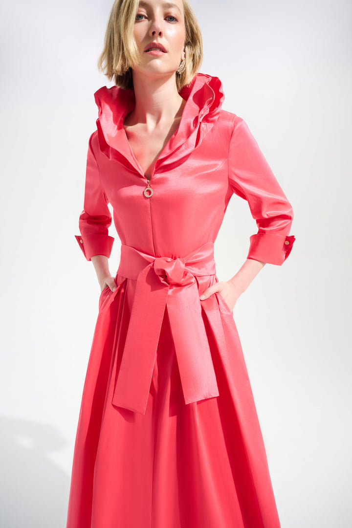 Woman wearing a pink dress with a white background