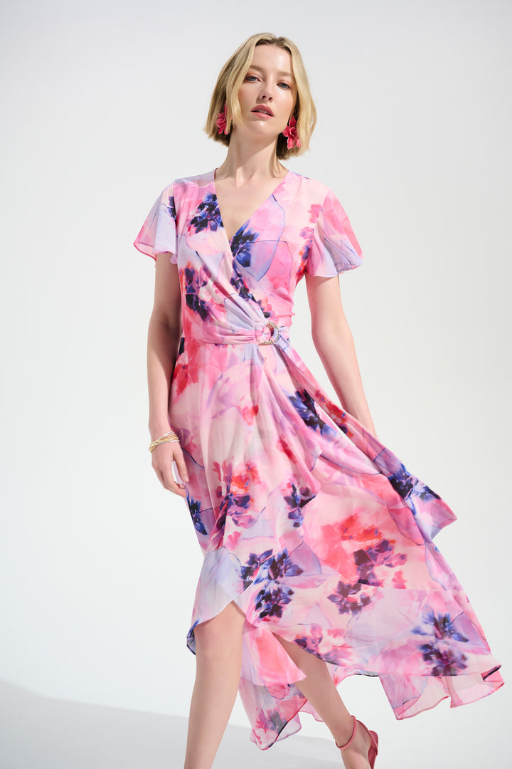 Woman wearing a pink floral dress on a white background