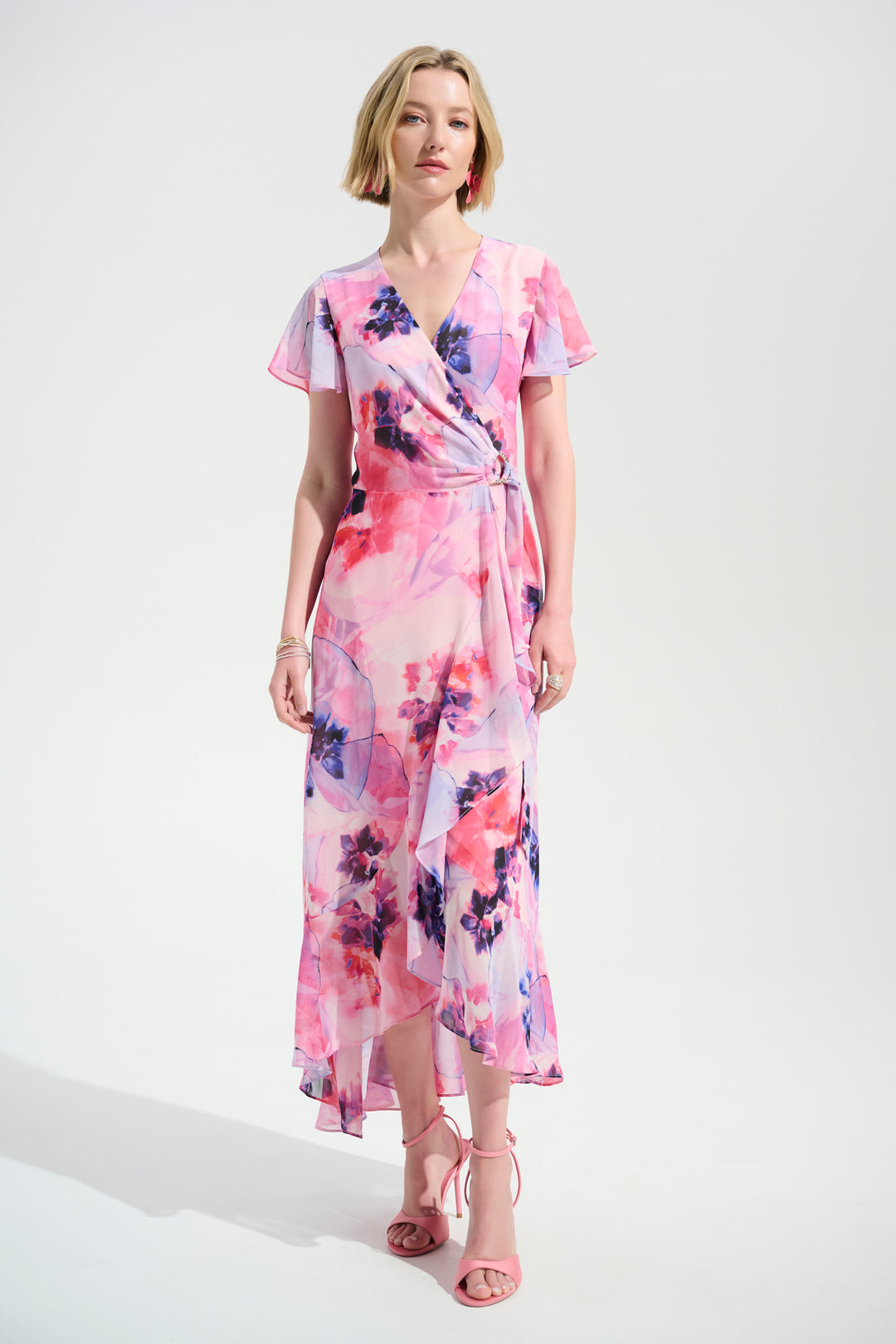 Woman wearing a floral dress on a white background