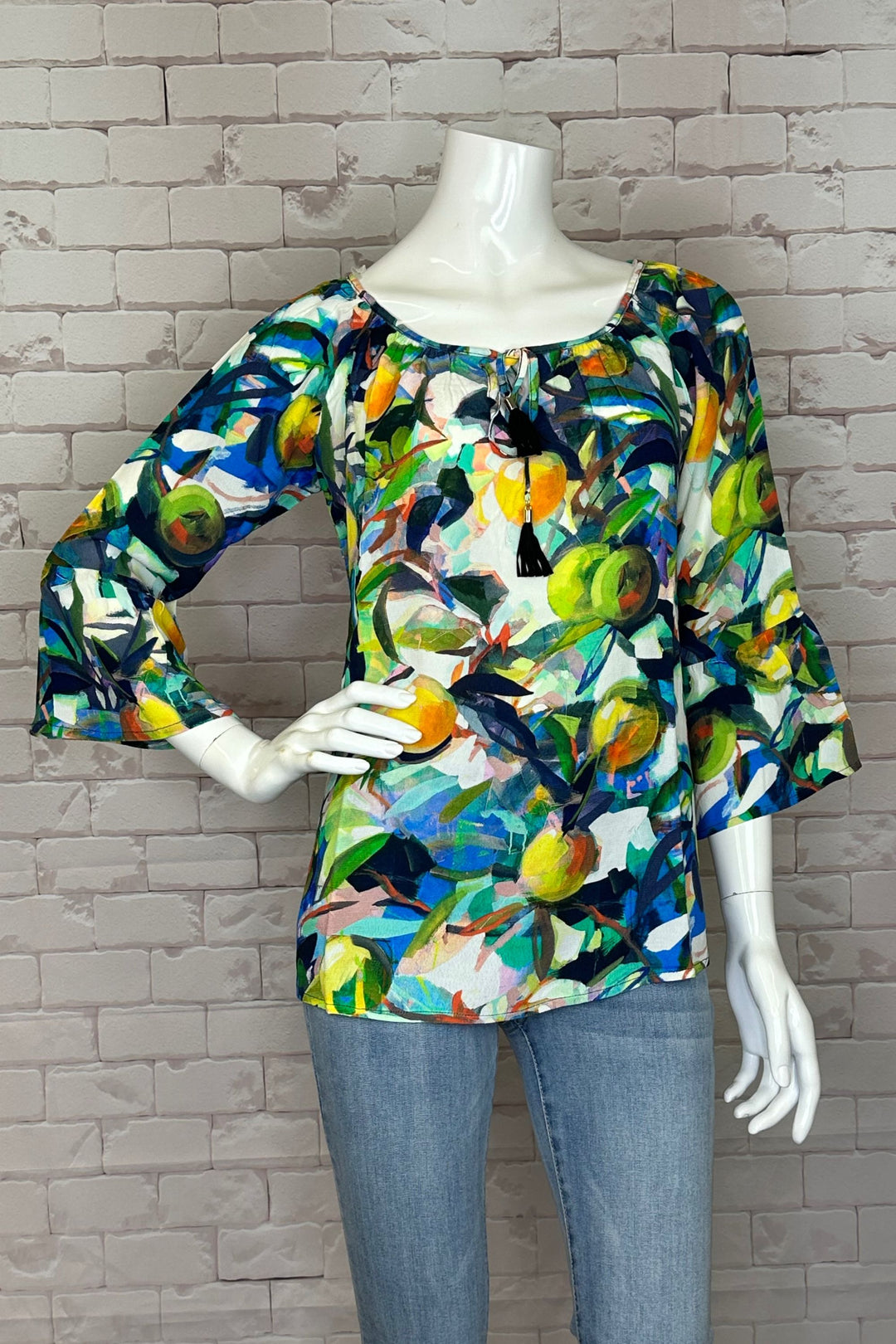 Step into spring wearing this Orangerie Ruffle Sleeve Top, lively lemon fruit abstract print, ruffle detail at the cuffs and dreamy light fabric.