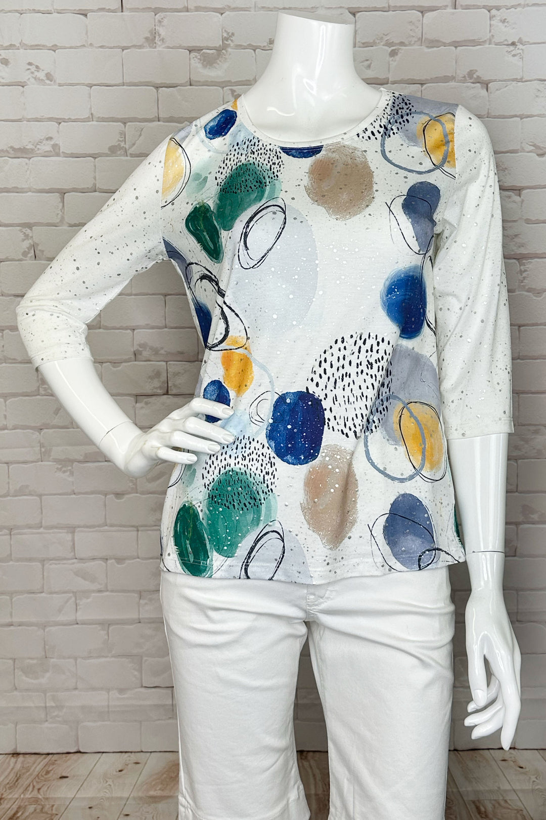 Ness Spring 2024 The round neckline and 3/4 length sleeves make it easy and comfortable to wear, while the vibrant dots print adds a touch of fun and playfulness to any outfit.