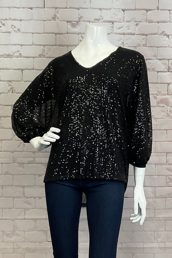 M Italy Fall 2024  With a soft cut v-neck and intricate sequin detailing throughout, this top provides a subtle shimmer shine. 