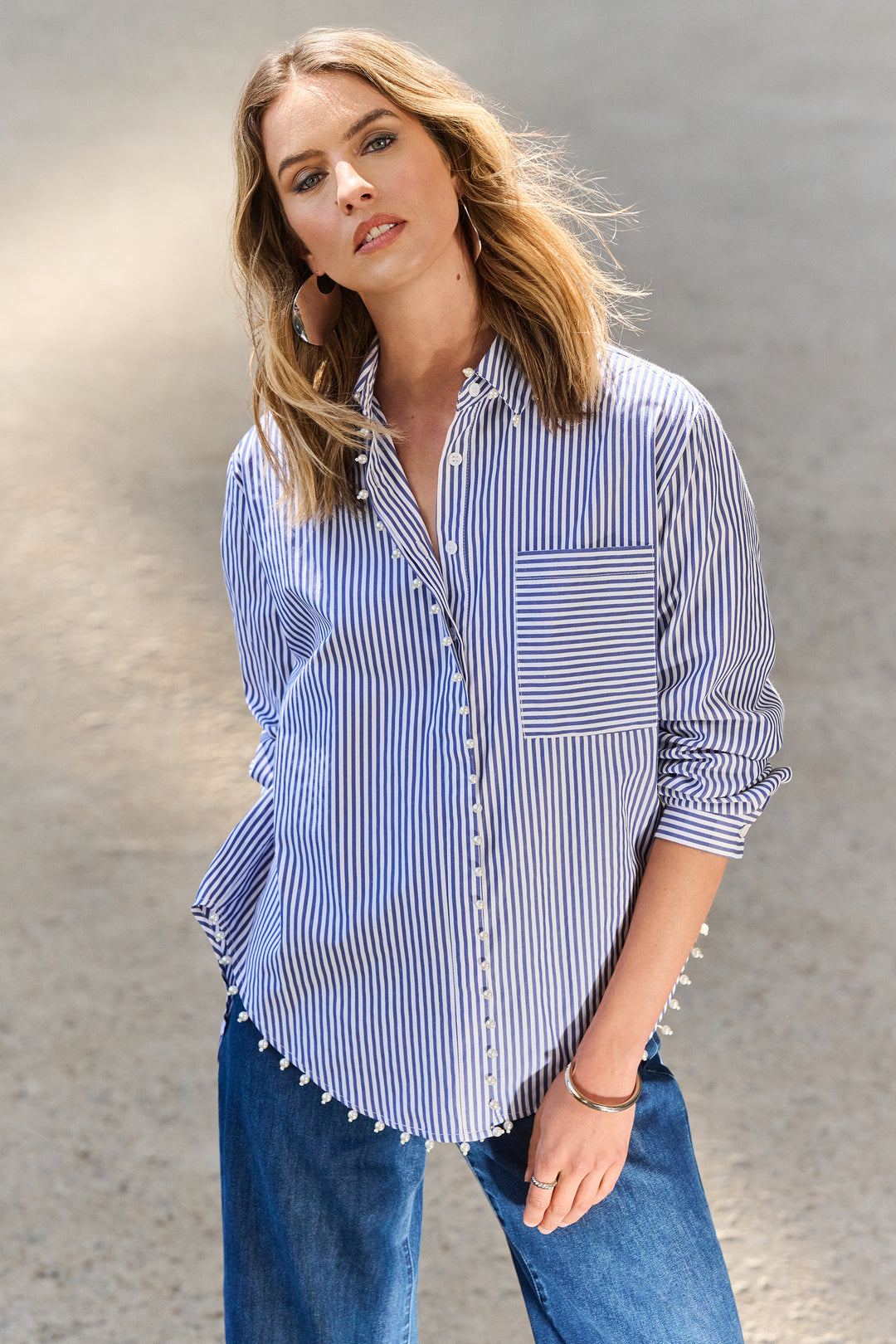 Joseph Ribkoff Spring 2025  Its understated grace will add a touch of timeless elegance to your wardrobe. Featuring a convenient chest pocket and full length shirt sleeves, this shirt offers both comfort and breathability. 