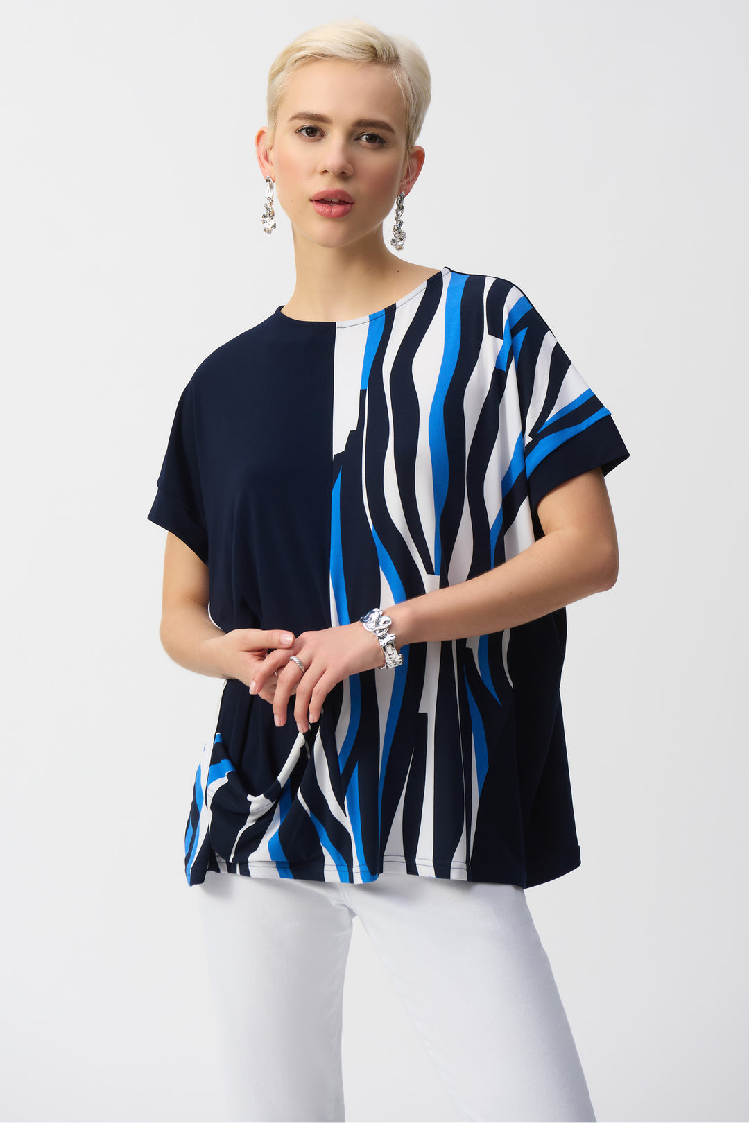 Joseph Ribkoff Spring 2025 Its contrast solid pattern on one side and abstract wavy pattern on the other adds understated elegance to any outfit!