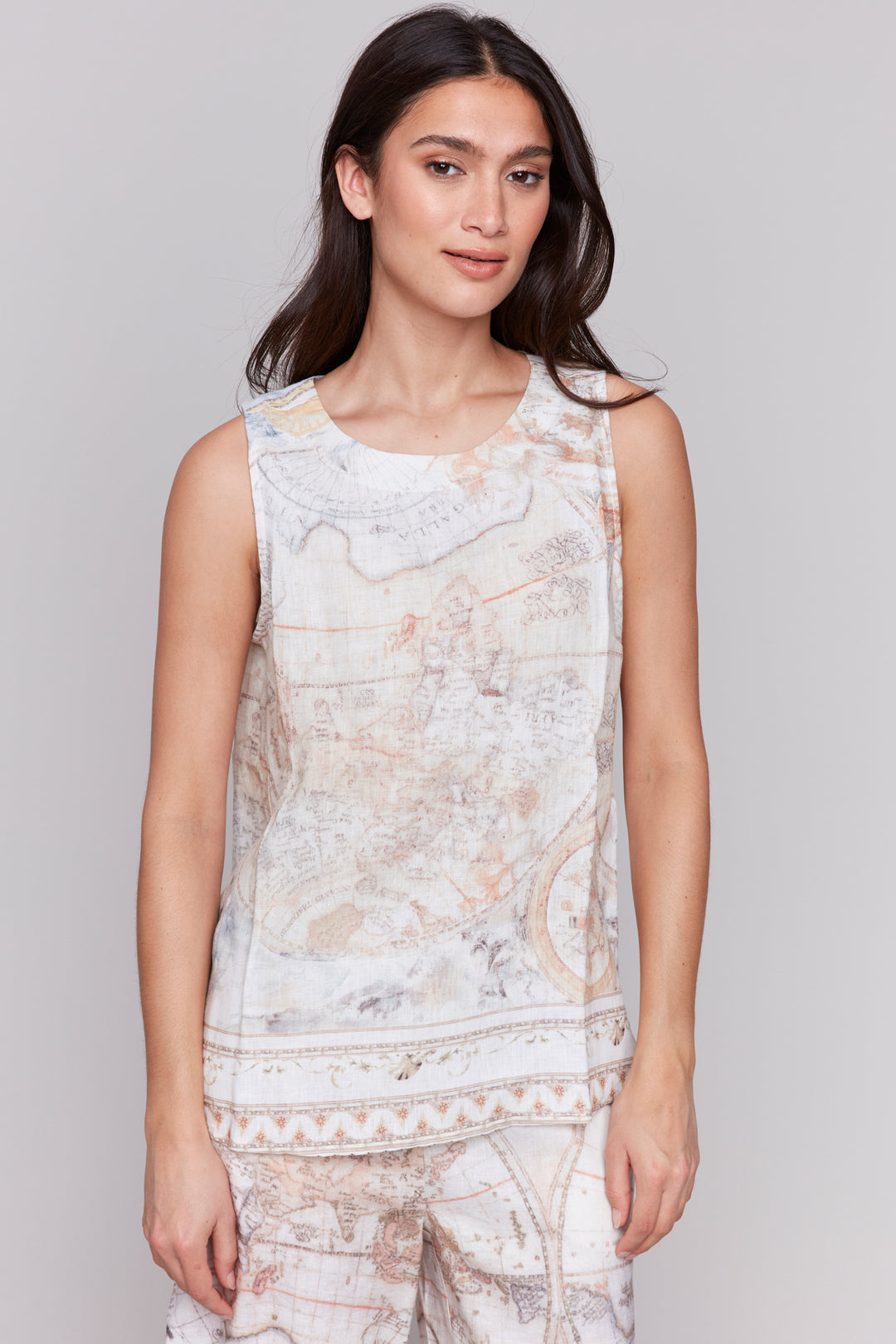 Charlie B Spring 2025 Made of a soft and lightweight woven linen blend, this tank top is anything but ordinary. With a unique border print along the hem and the atlas design above, you'll stand out from the crowd in the best way possible!