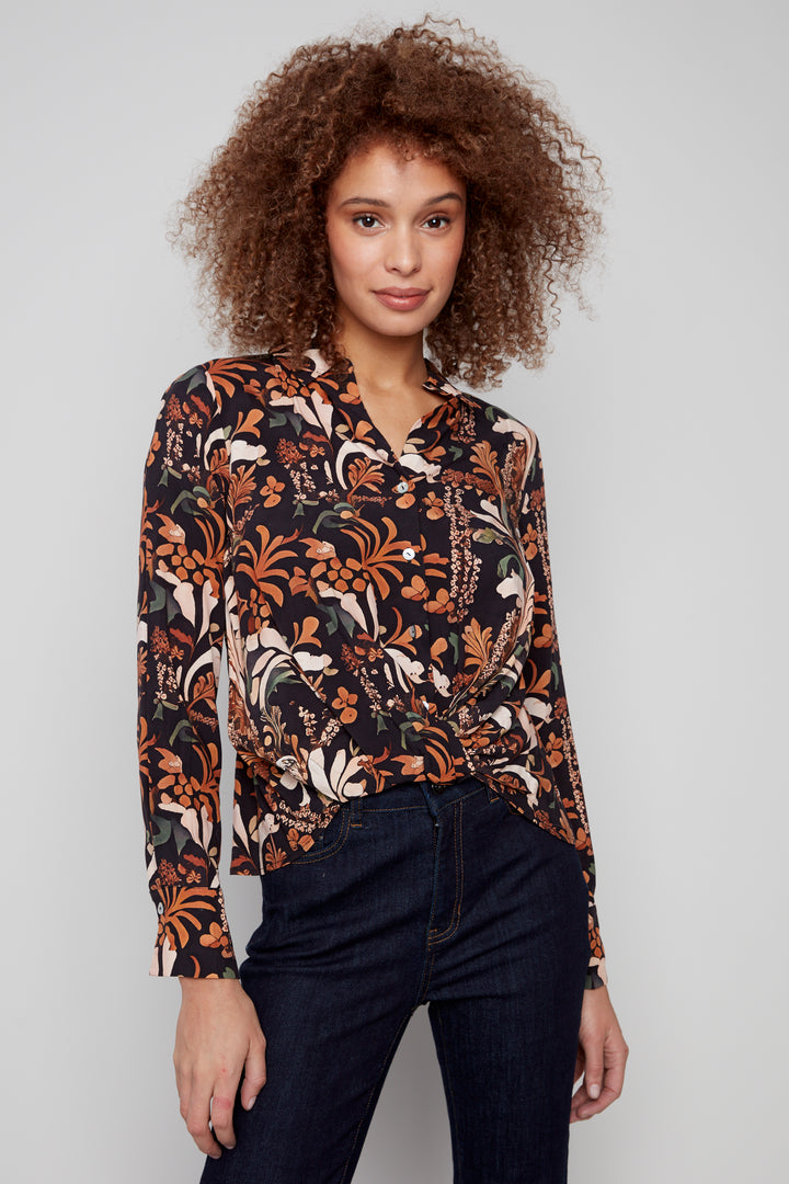 Charlie B Fall 2025 
This neat Batik Printed Twist Front Blouse is as light as a breeze, perfect for layering with a blazer or wearing solo.
