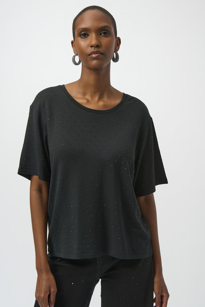 Joseph Ribkoff Fall 2025 
Elevate your casual look with this Black Scoop Neck Embellished Tee. Featuring a subtle touch of sparkle from bling gems throughout, it adds understated glamour to any outfit. The pullover design with short sleeves and a classic scoop neck ensures comfortable wear with a chic finish.