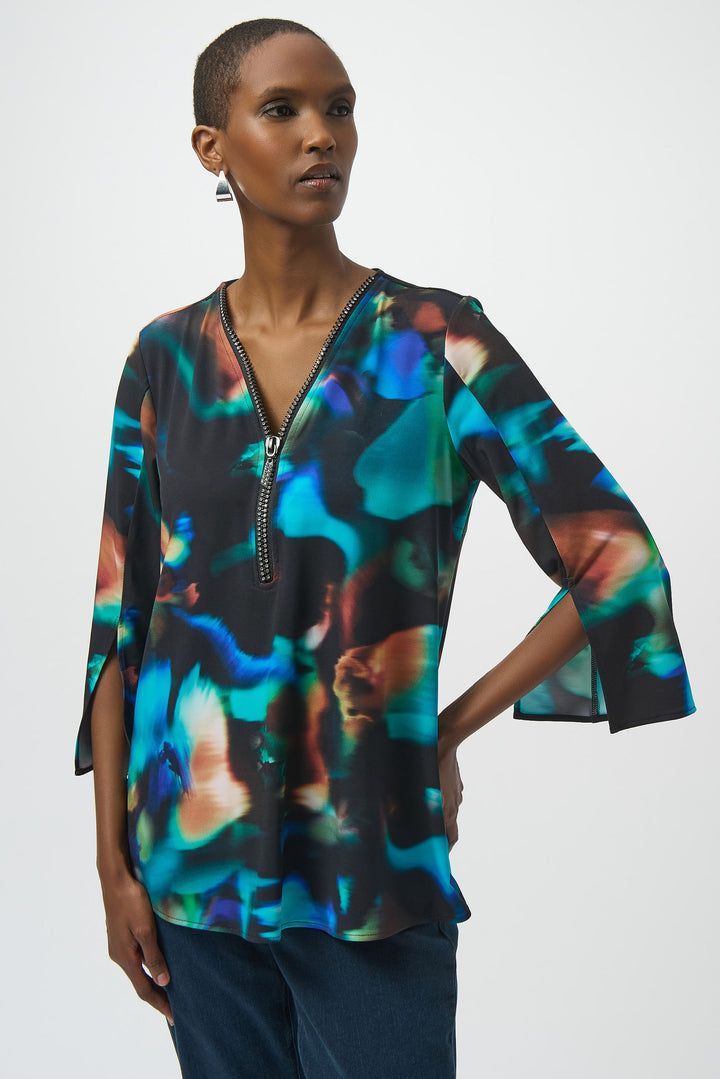 Joseph Ribkoff Fall 2025 
Be ready with this stylish Zip Neck Tunic! Featuring stunning 3/4 flare sleeves, a zipped v-neckline and a chic, modern yet classic flowing rose print top, this garment adds a unique touch to any wardrobe.