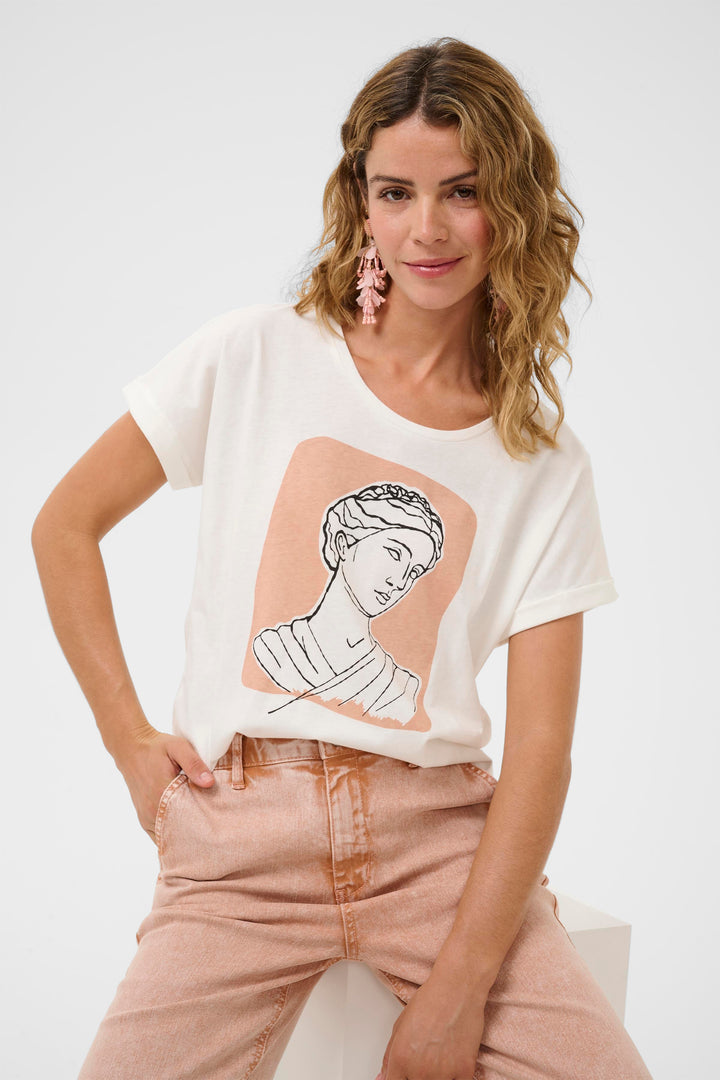 Woman wearing a white t-shirt with a graphic design on a white background