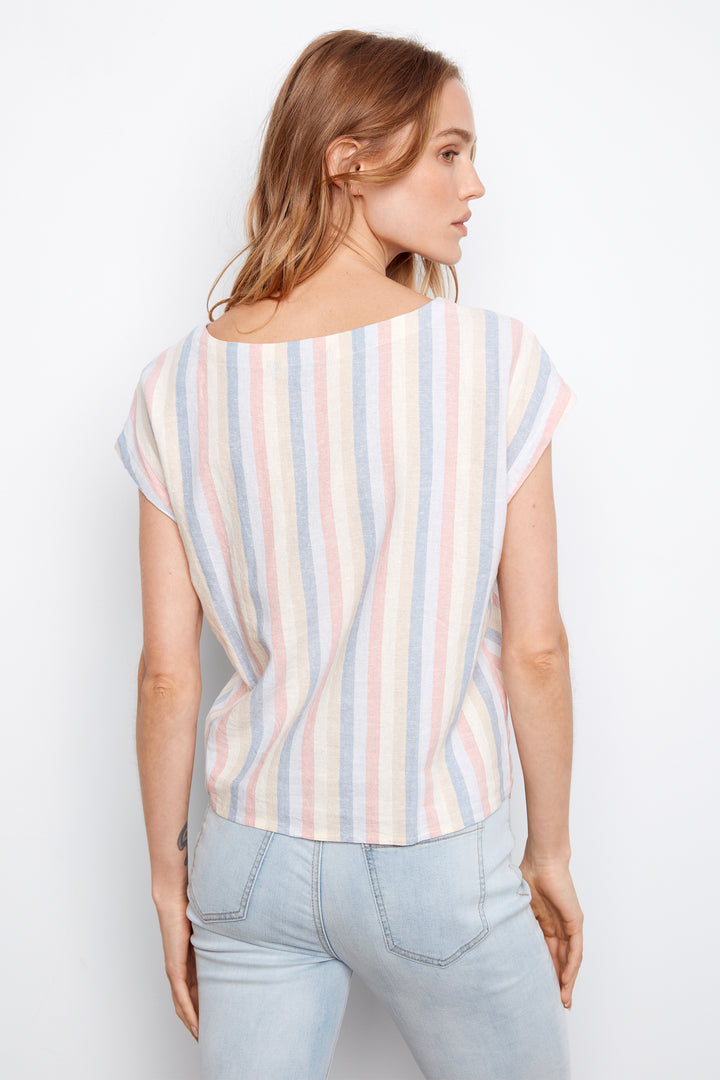 Woman wearing a striped shirt and light blue jeans on a white background