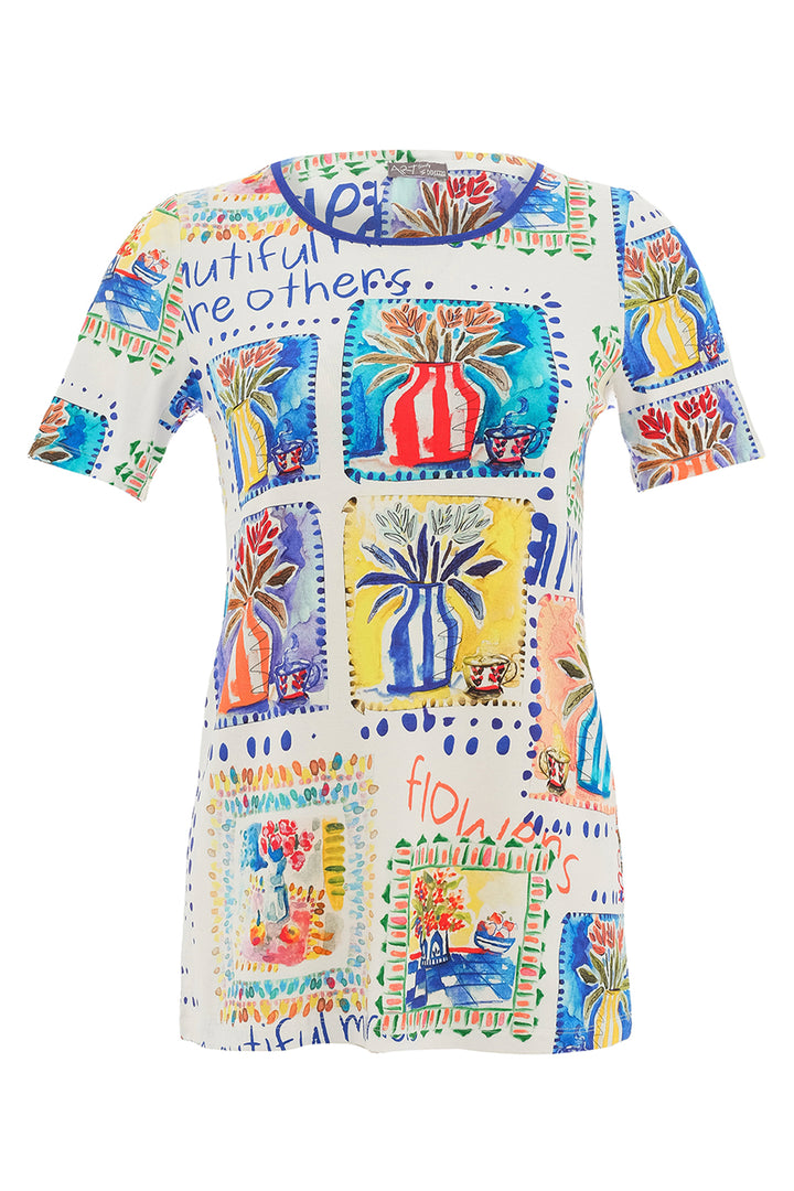 Colorful dress with floral and abstract patterns on a white background