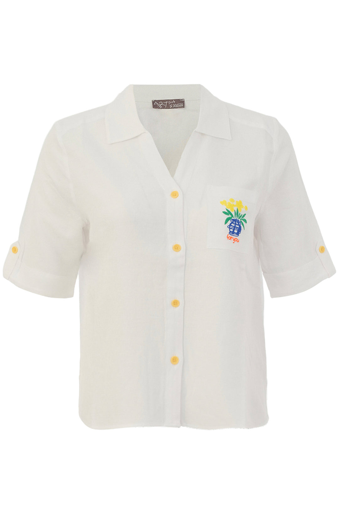 White blouse with embroidered design on a white background