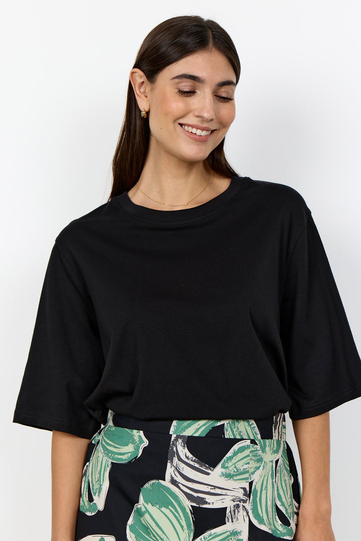 woman wearing half sleeve t-shirt on a white background. 
