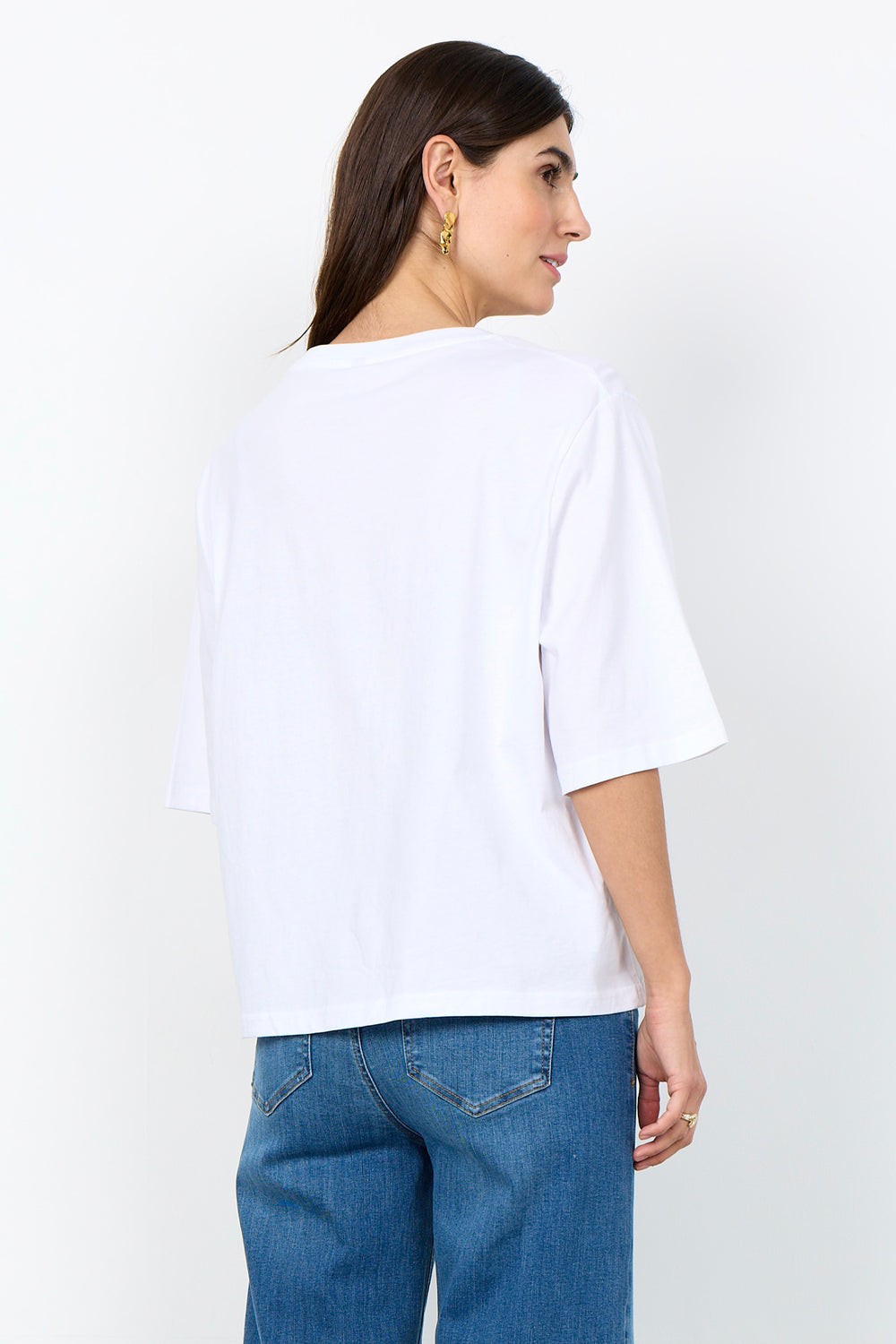 woman wearing half sleeve t-shirt on a white background. 