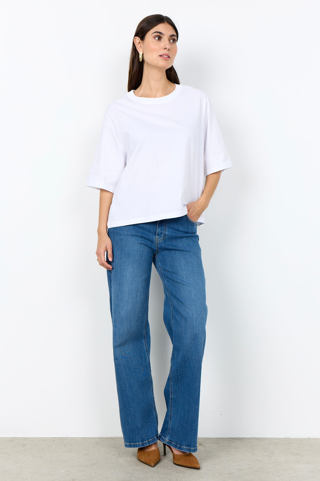 woman wearing half sleeve t-shirt on a white background. 