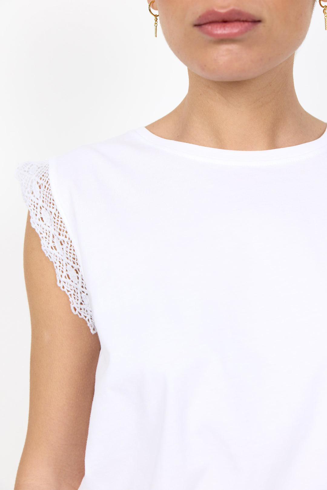White t-shirt with lace details on sleeves on a white background. 