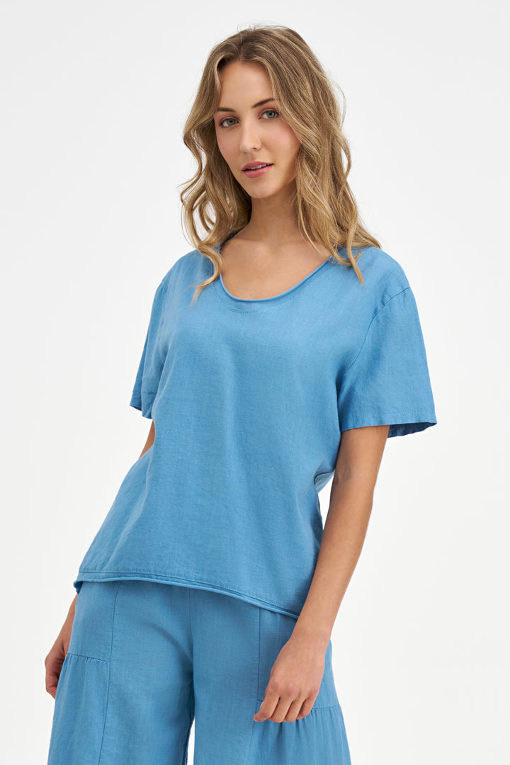 Woman wearing a blue outfit on a white background