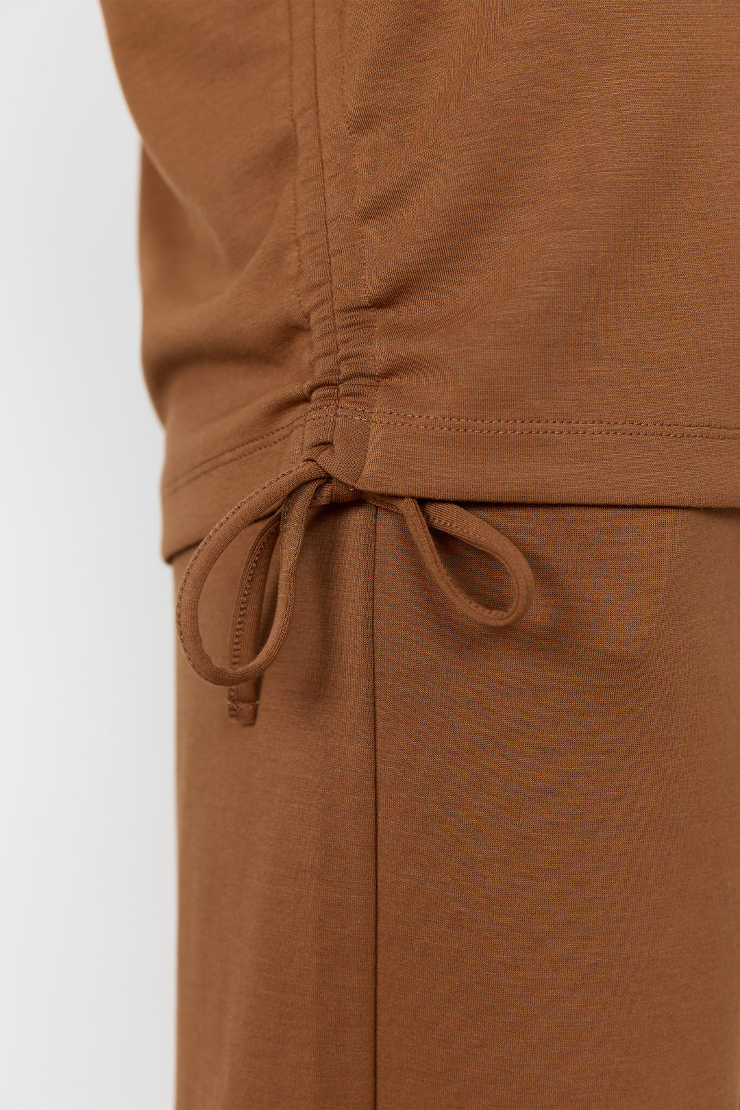 Toffee-colored top and matching shorts against a white background.