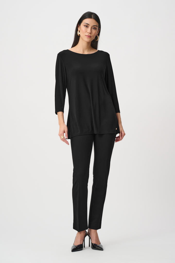 Woman wearing a black outfit on a white background