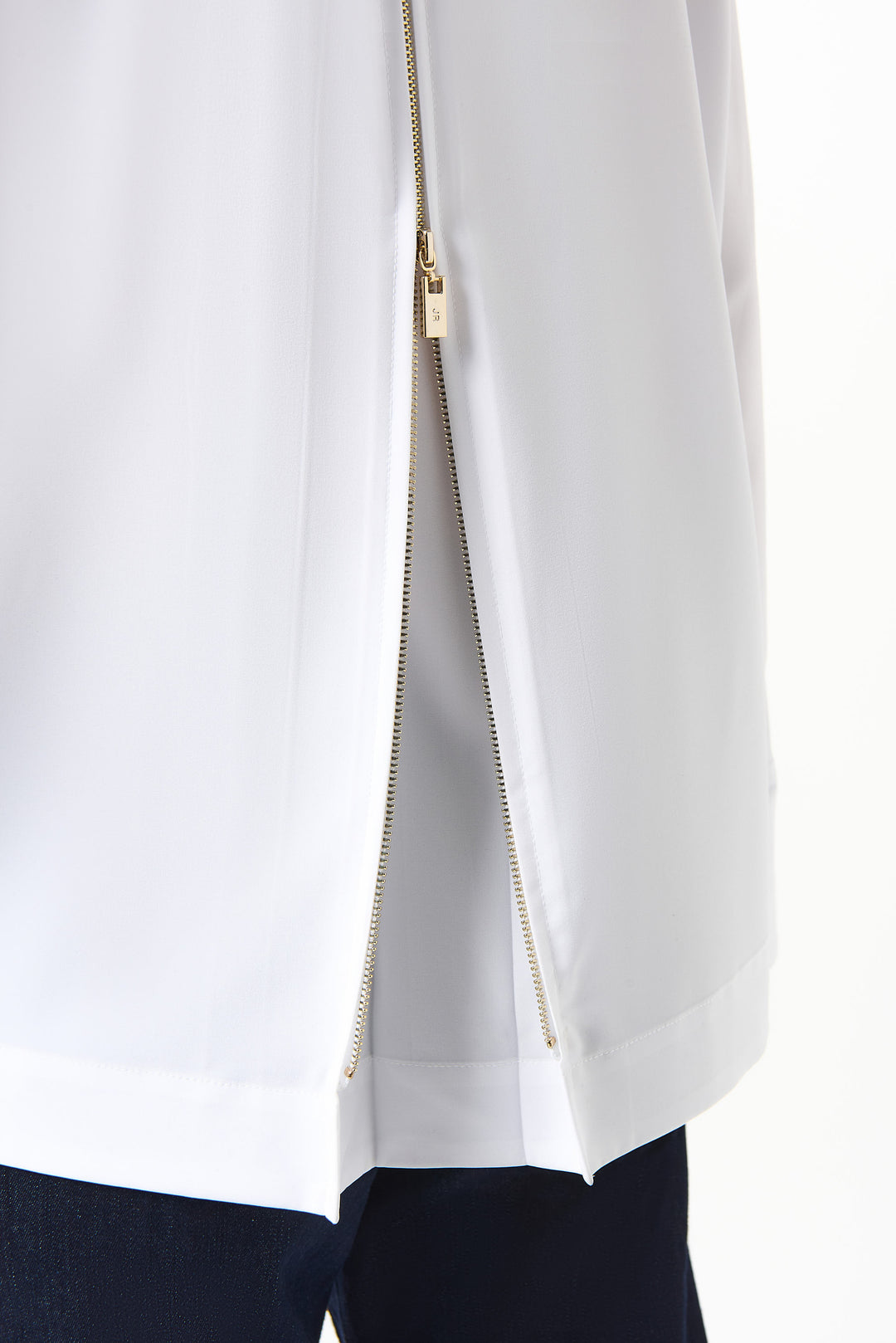 White blouse with a gold zipper on a white background