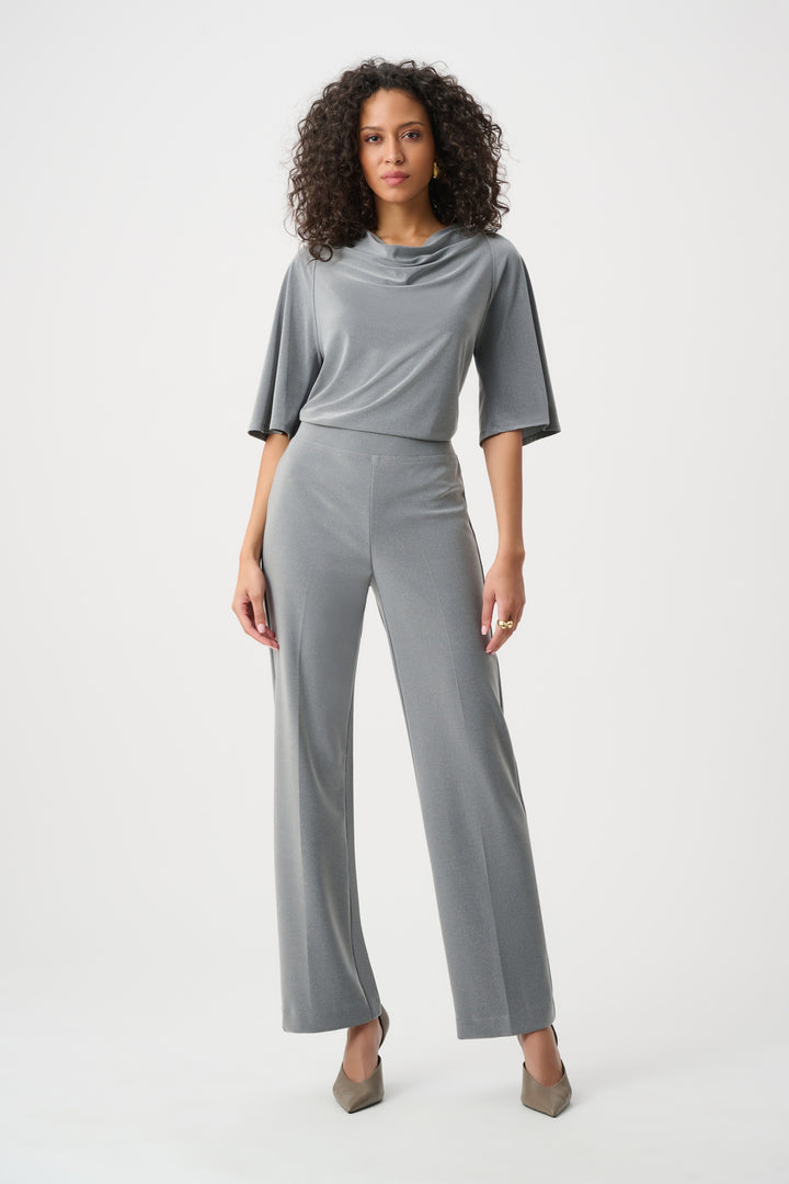 Woman wearing a gray outfit on a white background