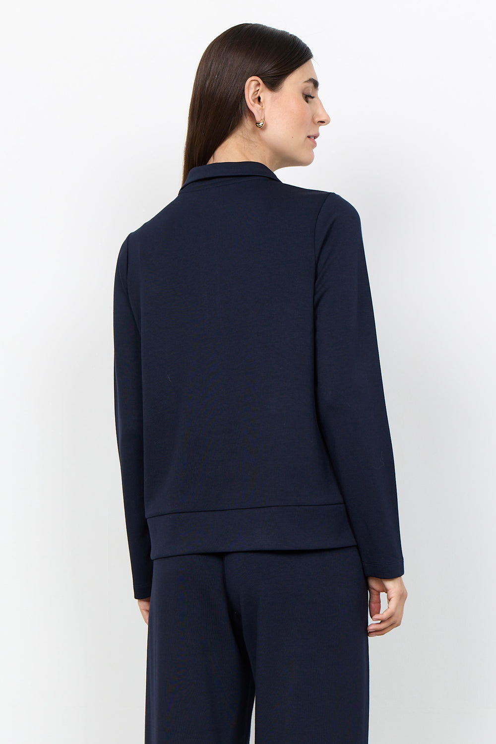 women's long sleeve casual blouse with a half zip on a white background. 