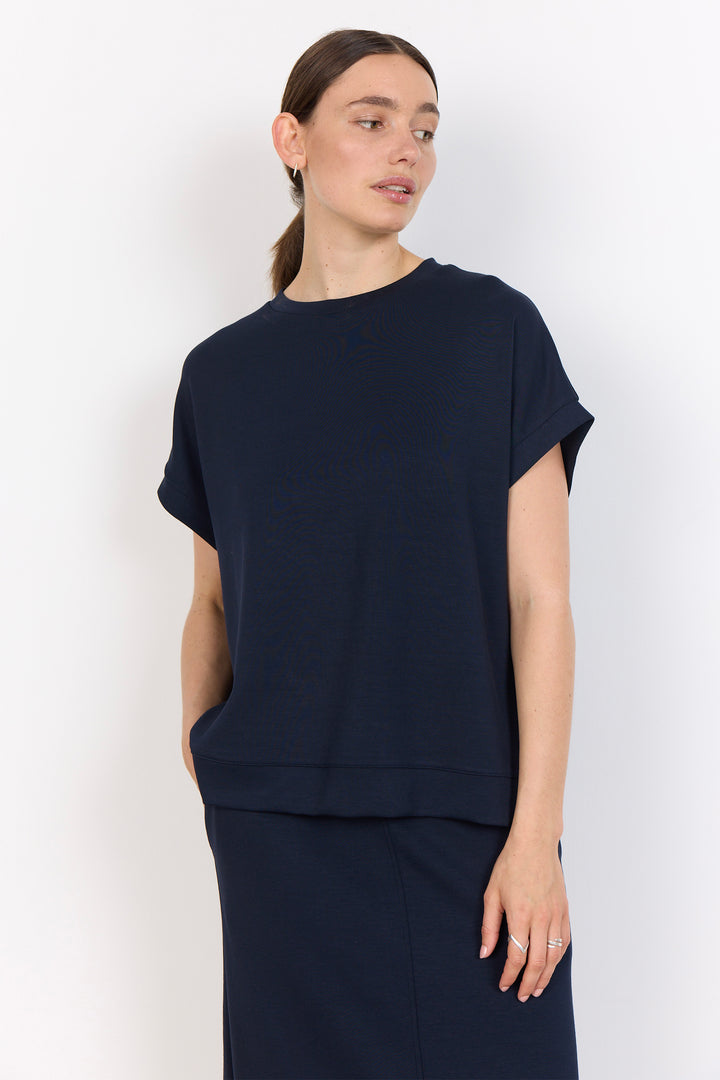 woman wearing a casual t-shirt on a white background. 