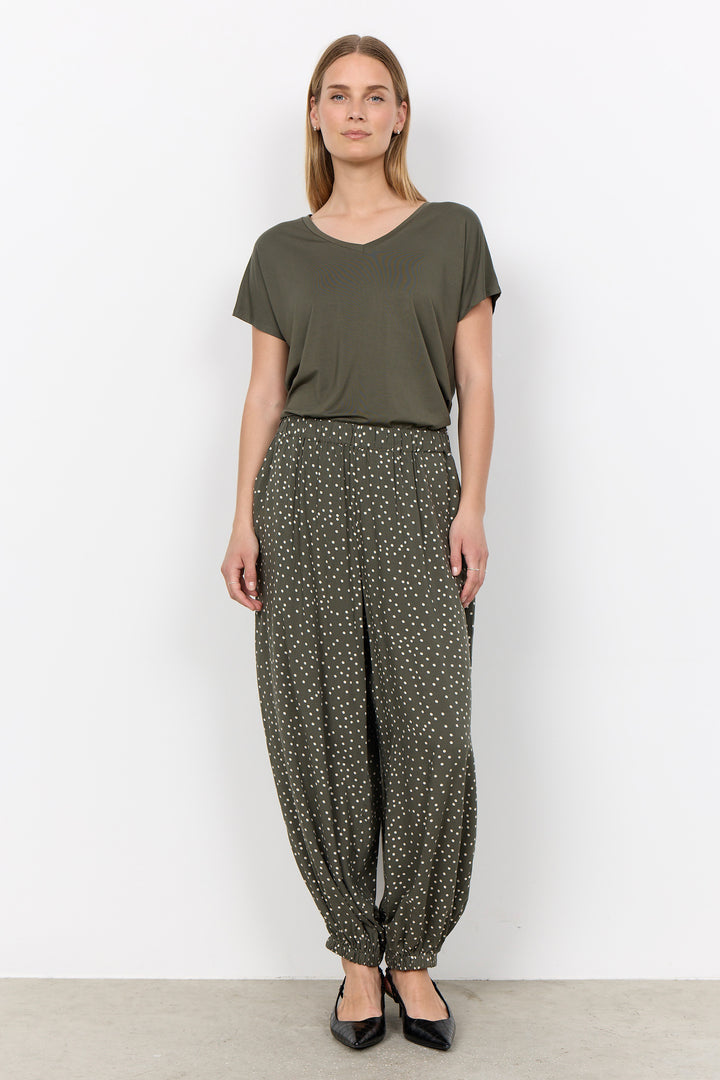 woman wearing a casual basic t-shirt on a white background. 