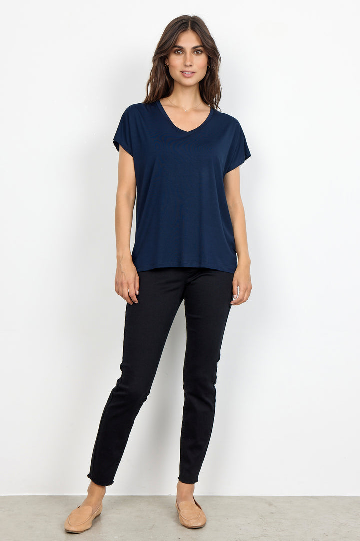 woman wearing a casual basic t-shirt on a white background. 