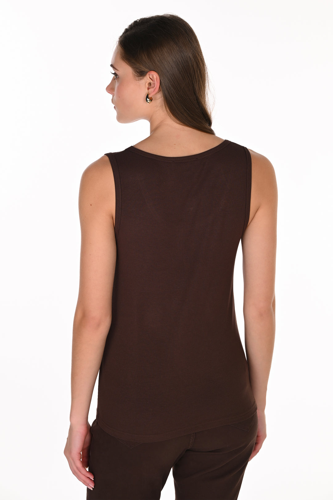 A woman shown from the back wearing a sleeveless dark brown top and matching dark brown bottoms against a plain white studio background.
