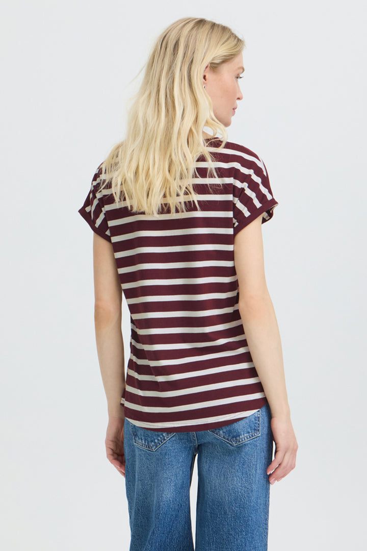 A woman shown from the back modeling a short-sleeve crewneck t-shirt with horizontal burgundy and off-white stripes, paired with blue jeans, against a light gray studio background.