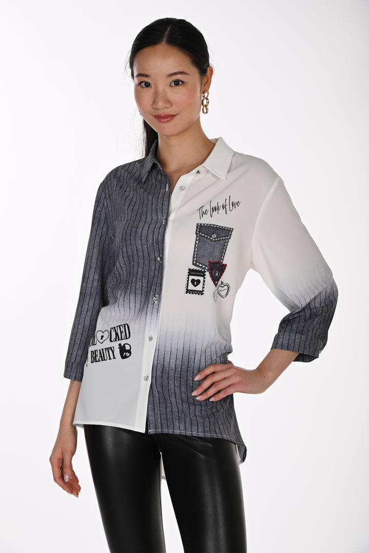 A woman modeling a long-sleeve button-up shirt with a white-to-dark-gray ombre design, featuring graphic patchwork details and text prints on a light gray studio background.