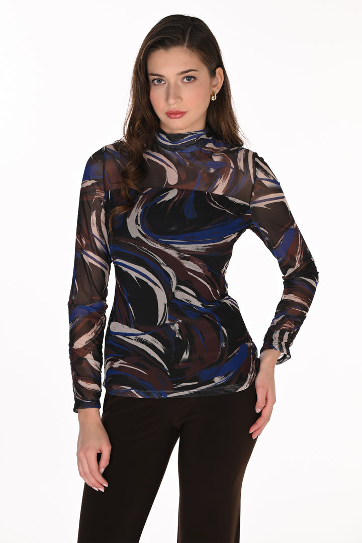 A woman modeling a sheer long-sleeve mock neck top with an abstract marbled swirl pattern in black, blue, brown, and white, paired with black pants against a plain white background.