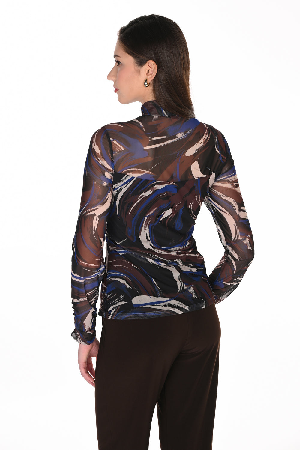 A woman shown from the back wearing a sheer long-sleeve mock-neck top with an abstract marbled swirl pattern in brown, blue, beige, and black, paired with dark brown pants, against a plain white background.